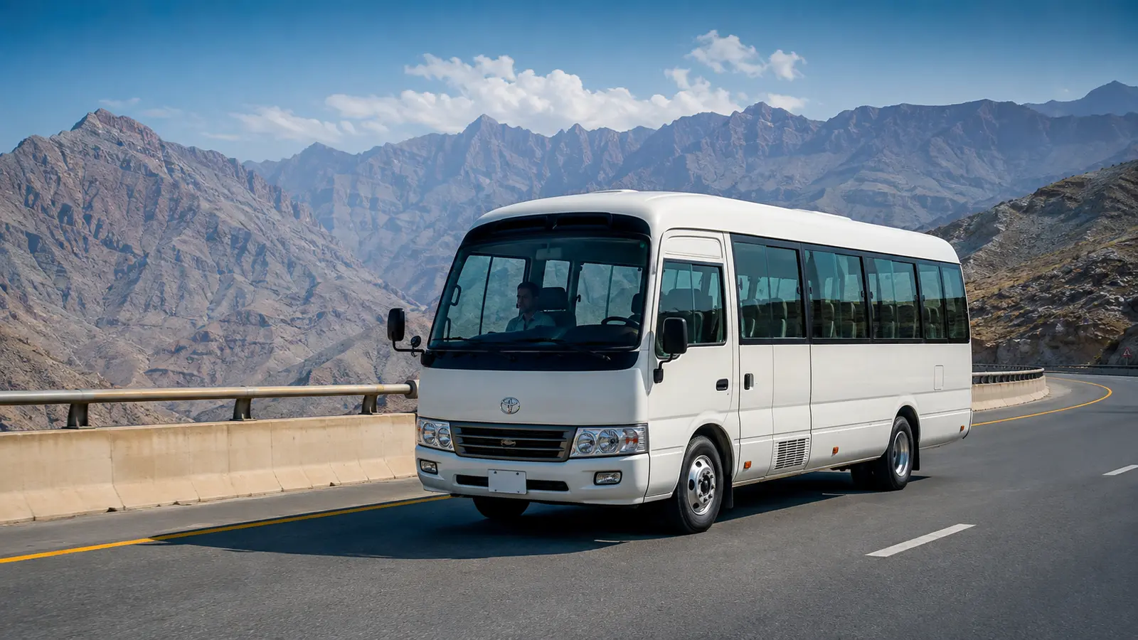 Bus rental Ras Al Khaimah with coach and RAK mountain and coastal context